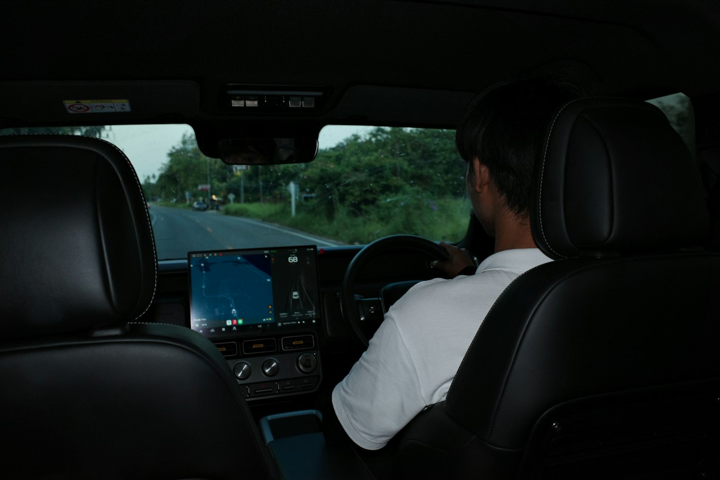 The view from the back seat: a driver on the road ahead